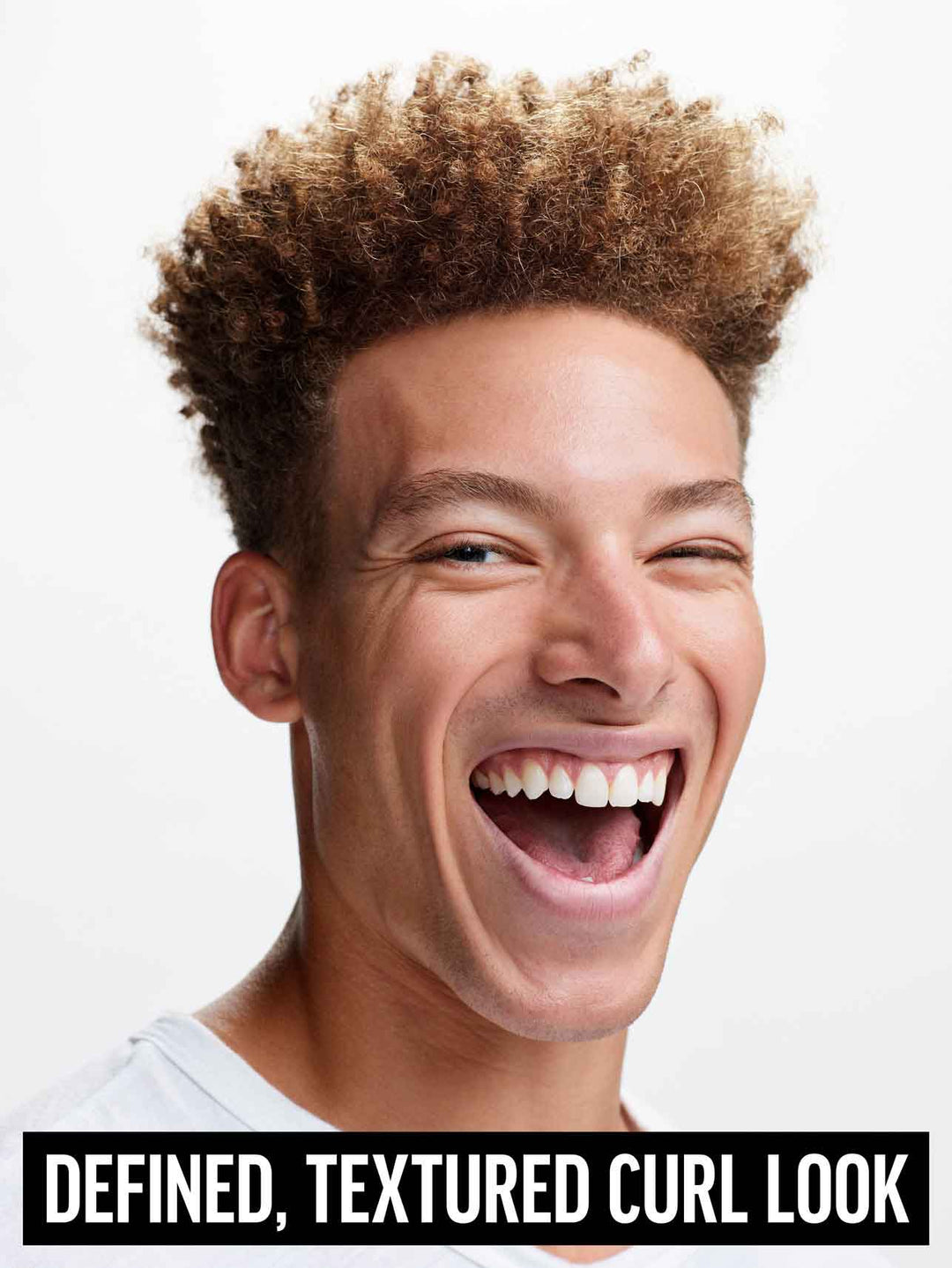 Heavy Hold Pomade on model for defined, textured curl look