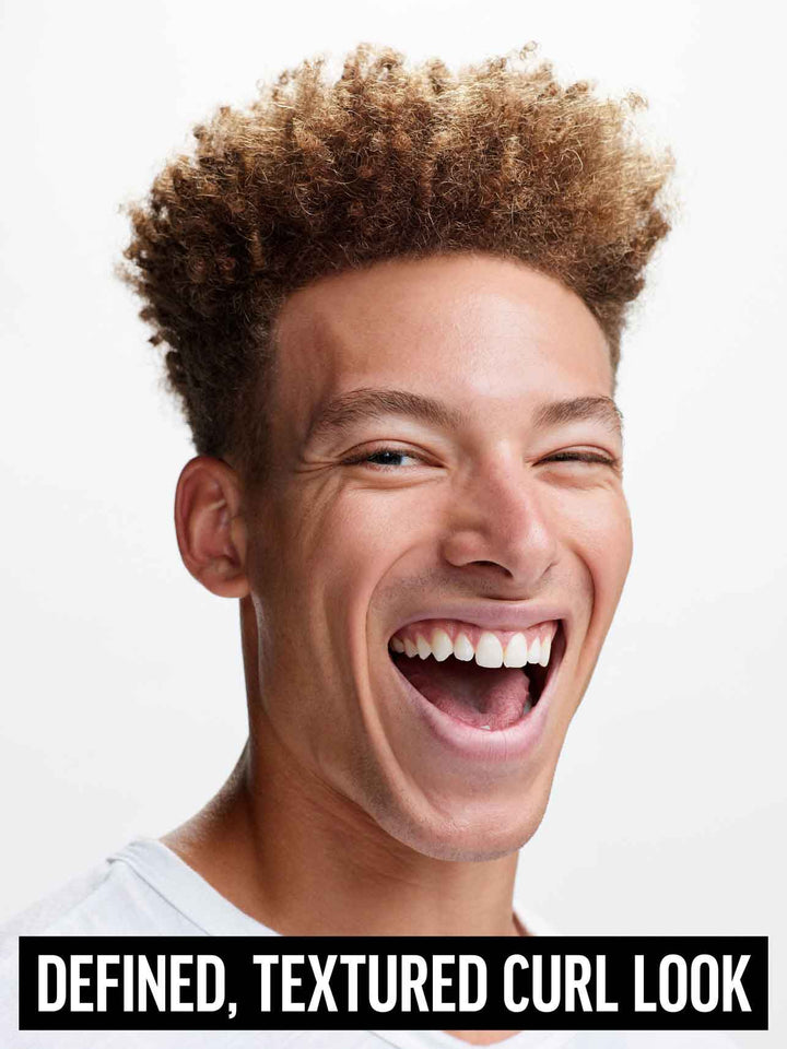 Heavy Hold Pomade on model for defined, textured curl look